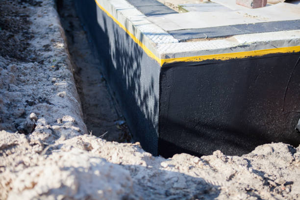 Professional Waterproofing technician working in Free Soil, MI